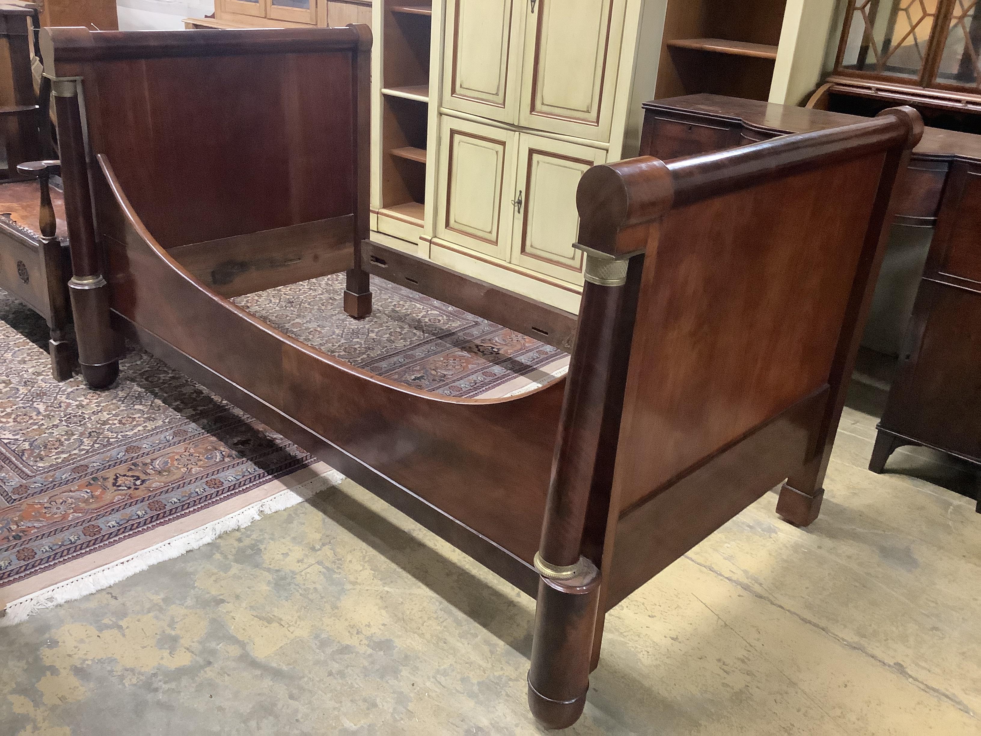 A 19th century French gilt metal mounted mahogany bateau en lit, length 190cm, width 107cm, height 107cm